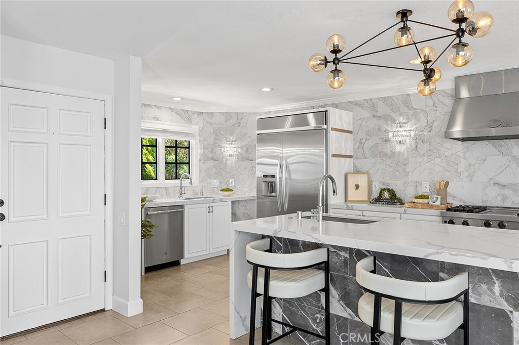 23966 Wanigan Way Laguna Niguel, CA 92677 - Photo 6 of 57 a kitchen with granite countertop a sink cabinets and stove