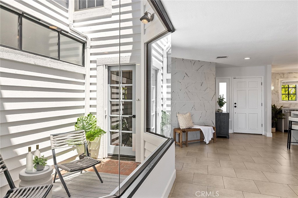 23966 Wanigan Way Laguna Niguel, CA 92677 - Photo 10 of 57 a living room with furniture and a large window