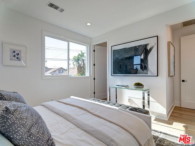 a bedroom with bed and window