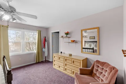 a bedroom with furniture and a window