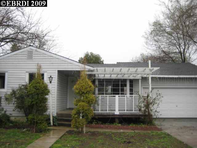 4360 Balfour Road Brentwood, CA 94513 - Photo 1 of 1 a view of a white house next to a yard with potted plants