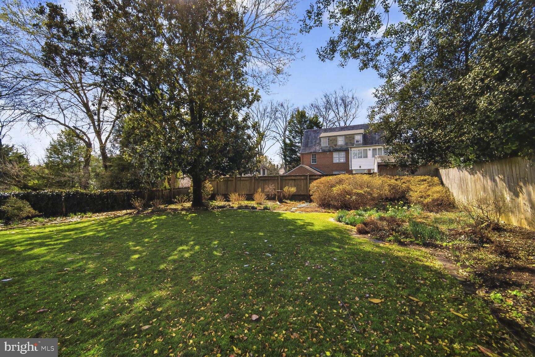 4934 Upton Street Northwest Washington, DC 20016 - Photo 4 of 5 a backyard of a house with lots of green space