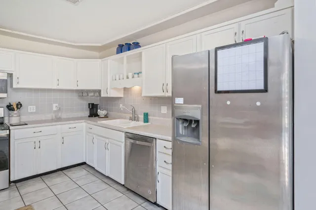 a bedroom that has a bed and a desk in it