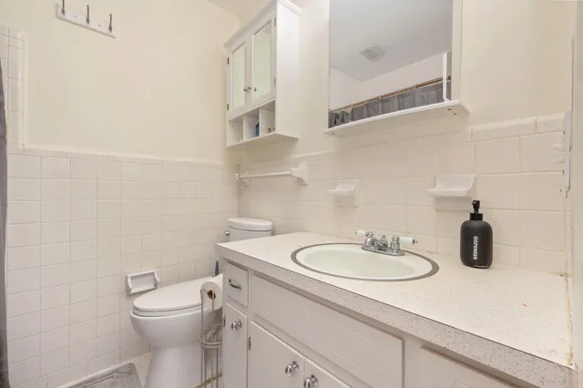 a bedroom with a bed and furniture