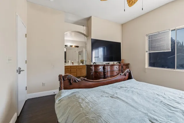 a bedroom with a bed and window