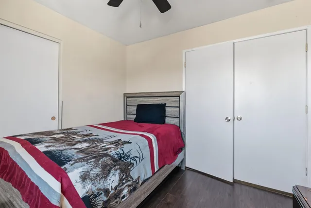 a bedroom with a bed and a fireplace