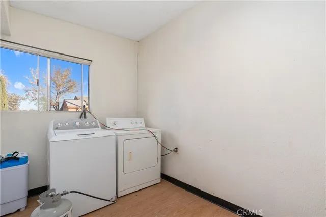 a view of a house with a tree in the background