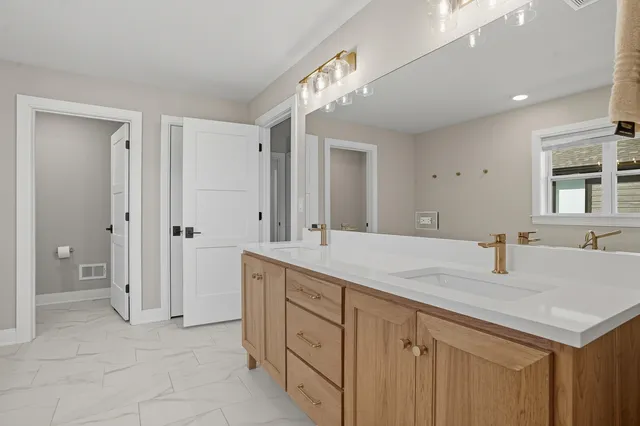 a bathroom with a sink and a mirror