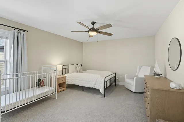 a bed room with a bed and a chandelier