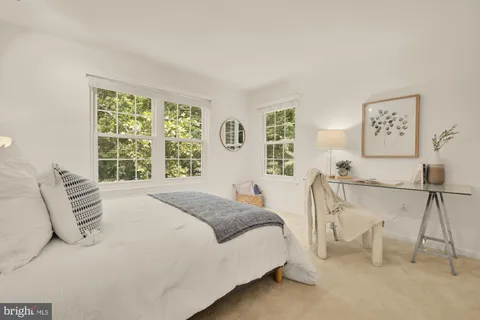 a bedroom with a bed and a table