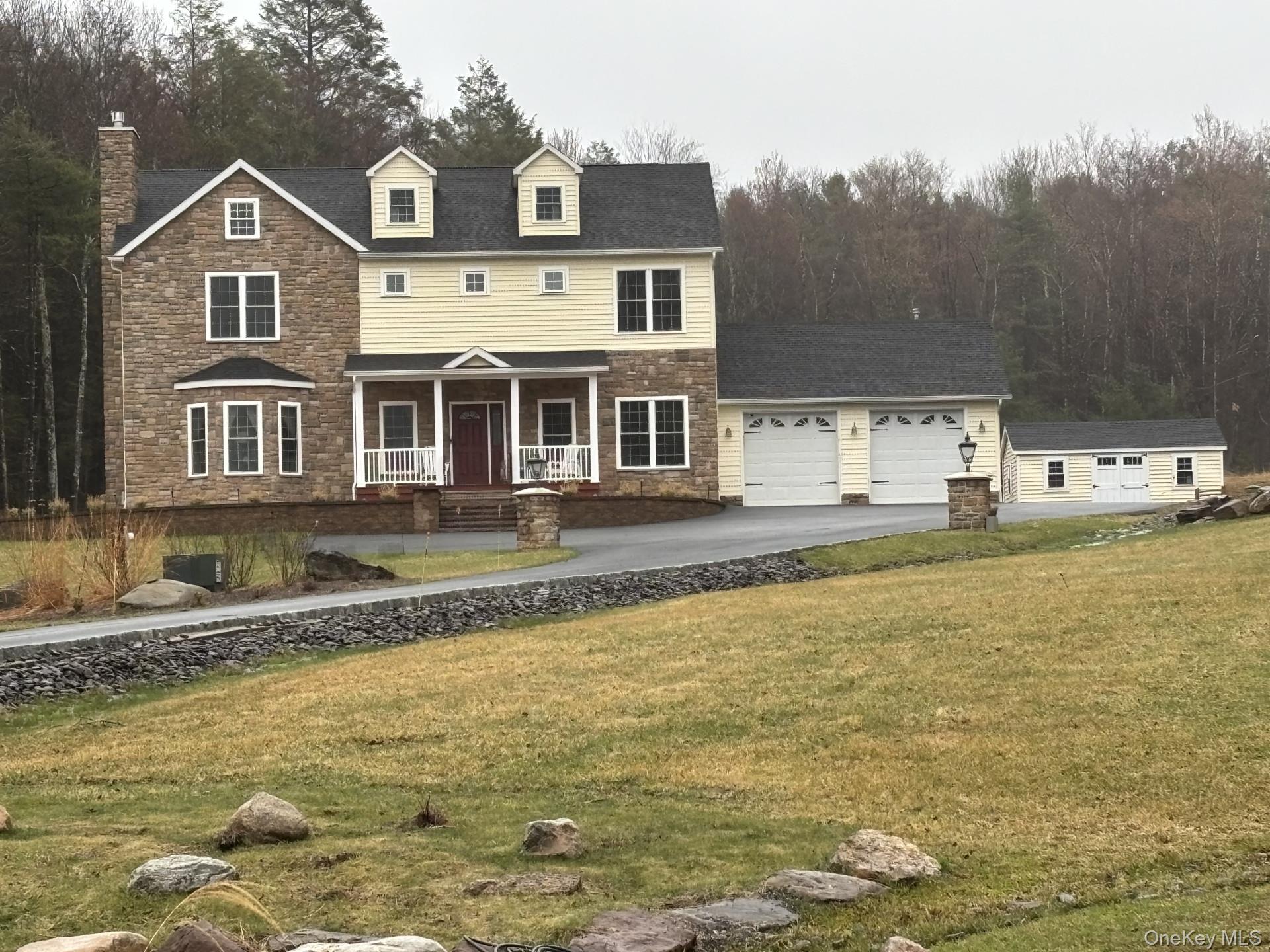 a front view of a house with swimming pool