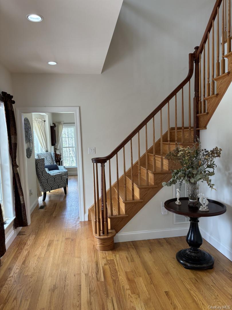657 Sackett Lake Road Monticello, NY 12701 - Photo 13 of 36 a view of entryway with wooden floor and stairs