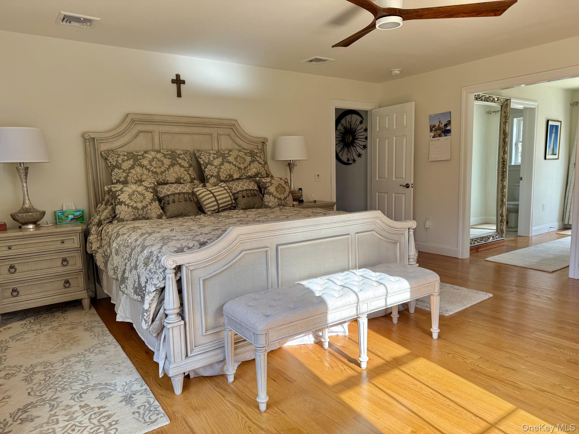 657 Sackett Lake Road Monticello, NY 12701 - Photo 16 of 36 a bedroom with a bed and wooden floor