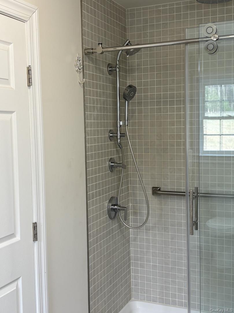 657 Sackett Lake Road Monticello, NY 12701 - Photo 18 of 36 a bathroom with a shower
