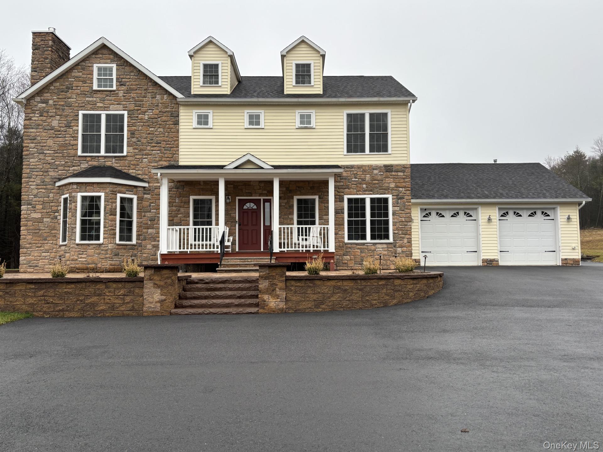 657 Sackett Lake Road Monticello, NY 12701 - Photo 2 of 36 a front view of a house with yard