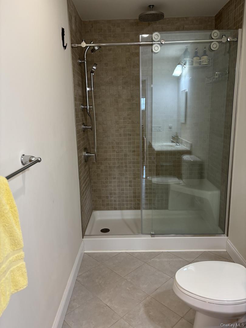 657 Sackett Lake Road Monticello, NY 12701 - Photo 21 of 36 a bathroom with a shower and a bathtub