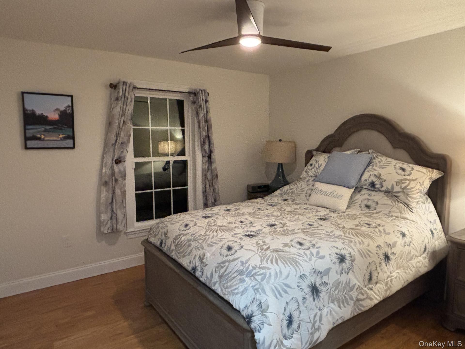 657 Sackett Lake Road Monticello, NY 12701 - Photo 23 of 36 a bedroom with bed and window