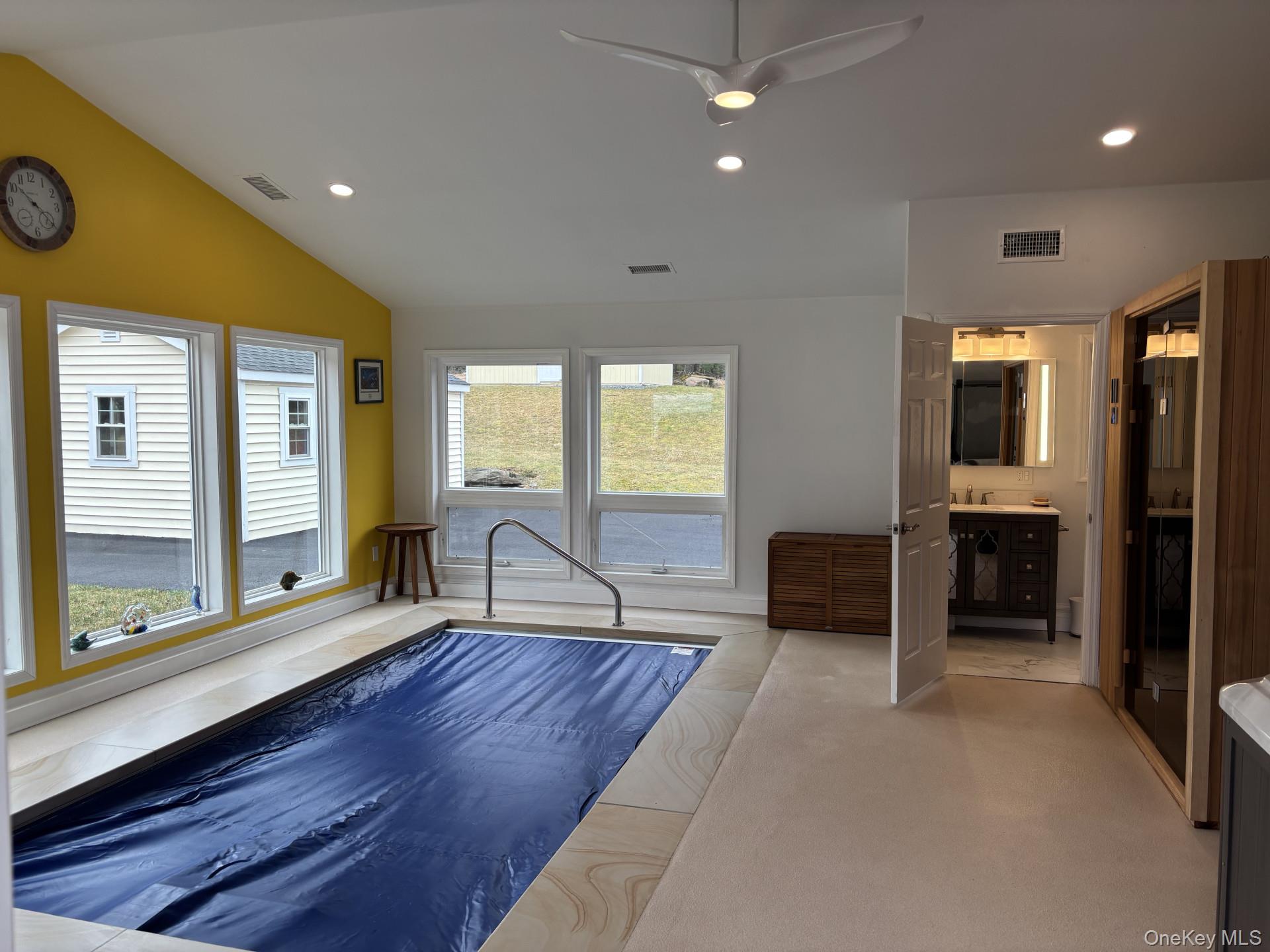 657 Sackett Lake Road Monticello, NY 12701 - Photo 25 of 36 a living room with furniture and a large window