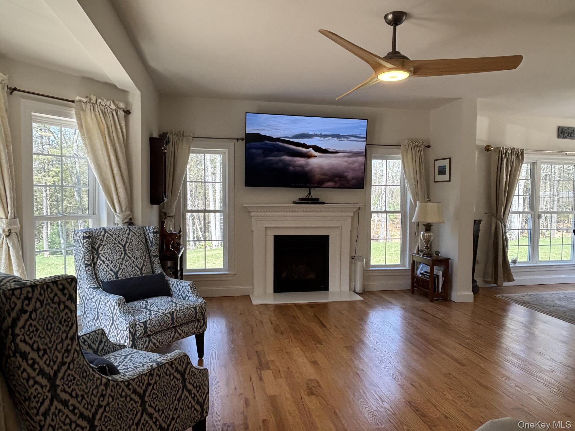 657 Sackett Lake Road Monticello, NY 12701 - Photo 6 of 36 a living room with furniture and a fireplace