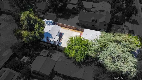 an aerial view of house with yard