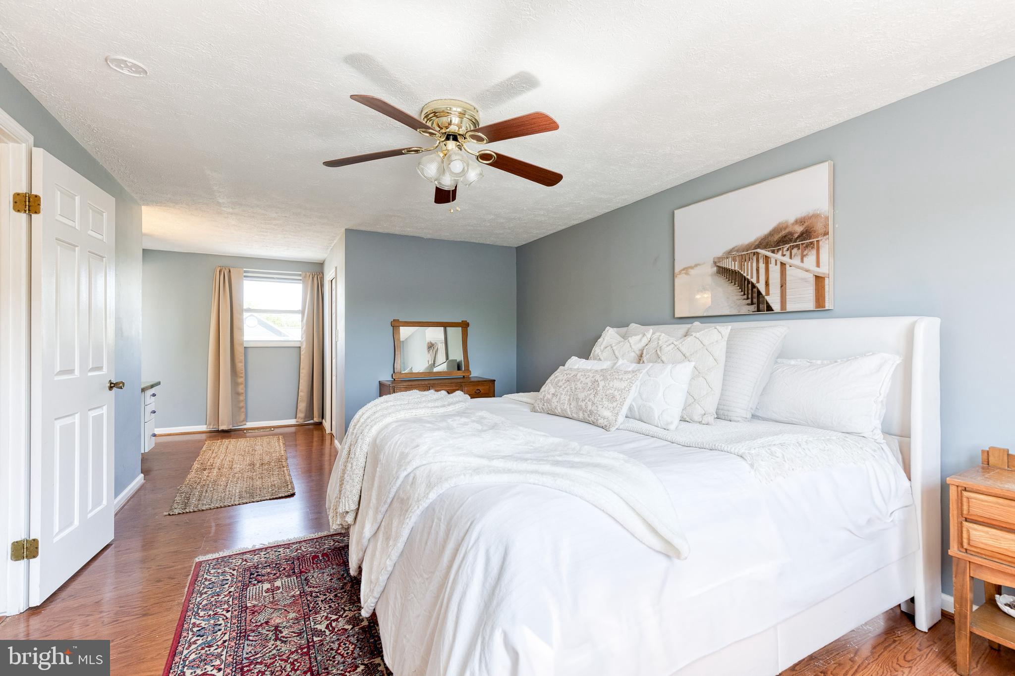 1421 Gesna Drive Hanover, MD 21076 - Photo 22 of 47 a bedroom with a large bed and a chandelier