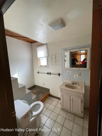 a view of a bathroom with dual sinks