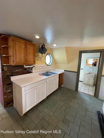 a kitchen with a cabinets and sink