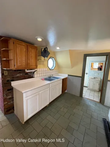 a kitchen with a cabinets and sink