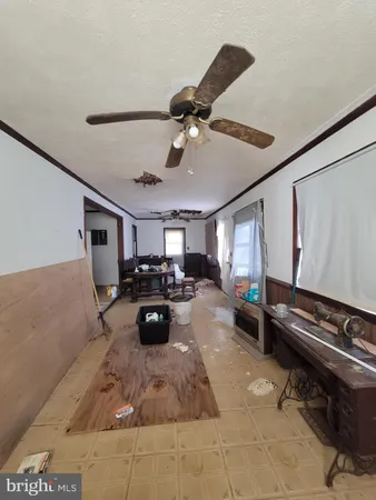 a living room with furniture and a piano