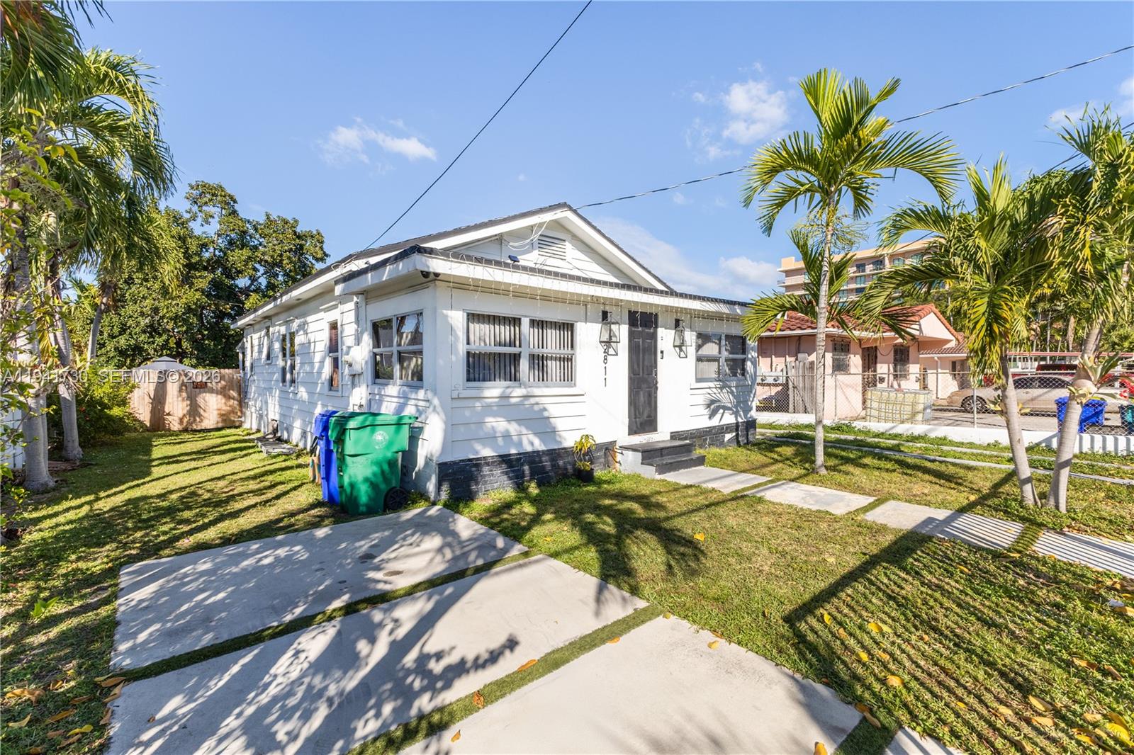 2811 Southwest 17th Street Miami, FL 33145 - Photo 5 of 36 a front view of a house with a yard table and chairs