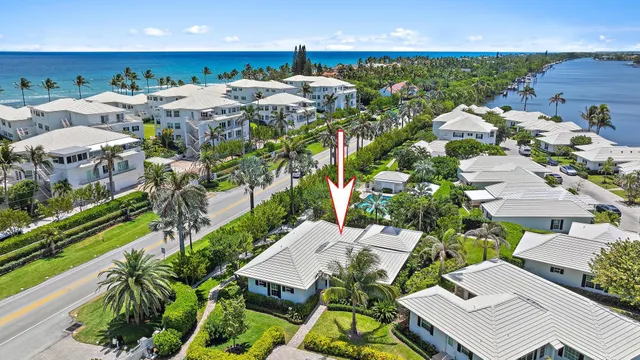 an aerial view of a house with garden space and street view