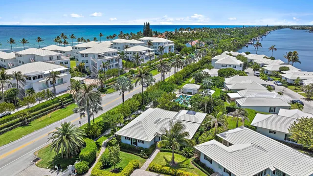 an aerial view of a house with garden space and street view