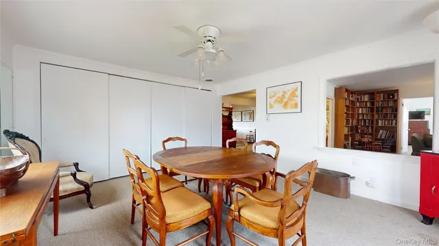 a dining room with furniture and window