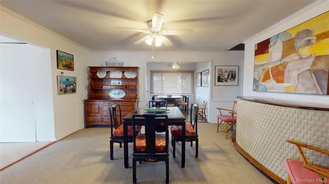 a view of a workspace with furniture and window