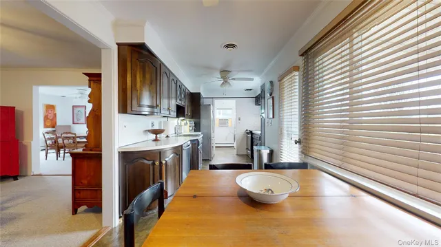 a kitchen with stainless steel appliances granite countertop a sink and cabinets