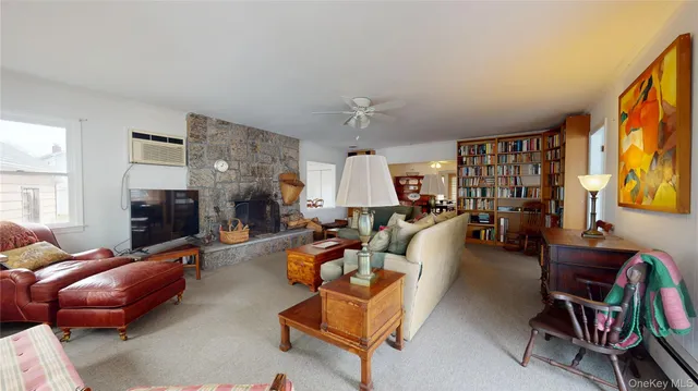 a bedroom with furniture and large windows