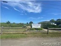 a view of a lake with a yard