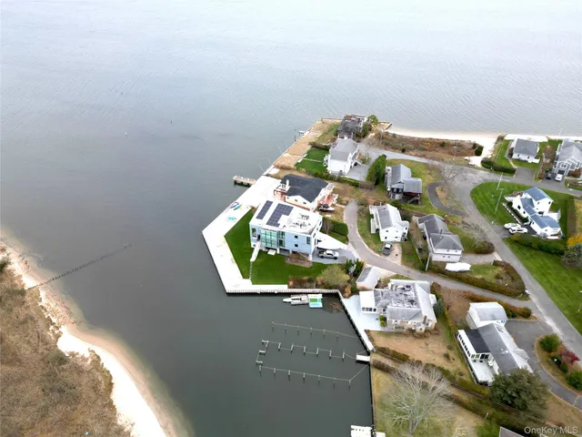 an aerial view of a house with a lake view