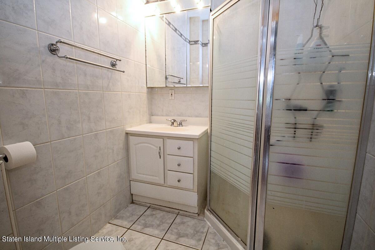 985 Lorimer Street Brooklyn, NY 11222 - Photo 17 of 23 a bathroom with a shower and a sink