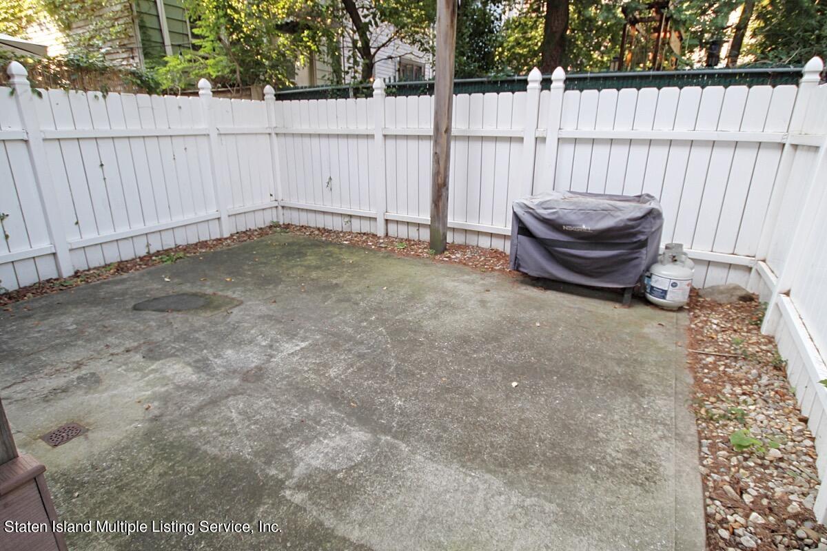 985 Lorimer Street Brooklyn, NY 11222 - Photo 23 of 23 a view of backyard and wooden fence