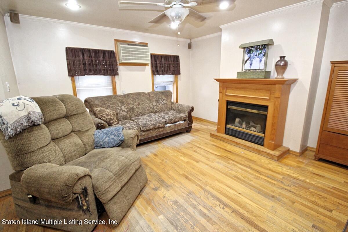 985 Lorimer Street Brooklyn, NY 11222 - Photo 4 of 23 a bedroom with furniture and a fireplace