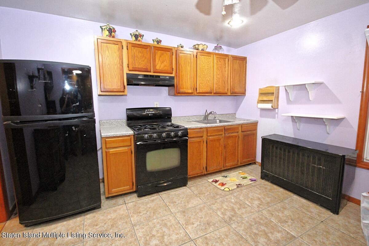 985 Lorimer Street Brooklyn, NY 11222 - Photo 5 of 23 a kitchen with a sink stove and refrigerator