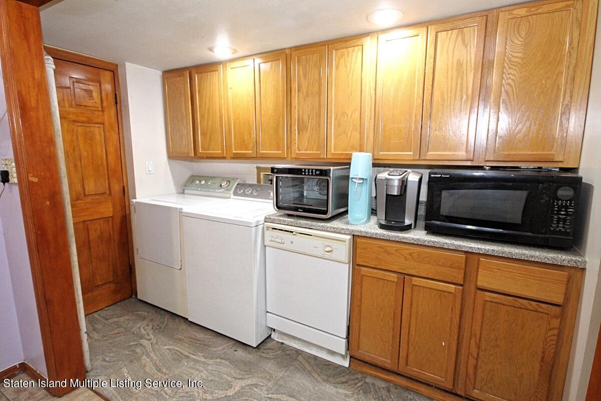 985 Lorimer Street Brooklyn, NY 11222 - Photo 6 of 23 a kitchen with appliances cabinets and a sink