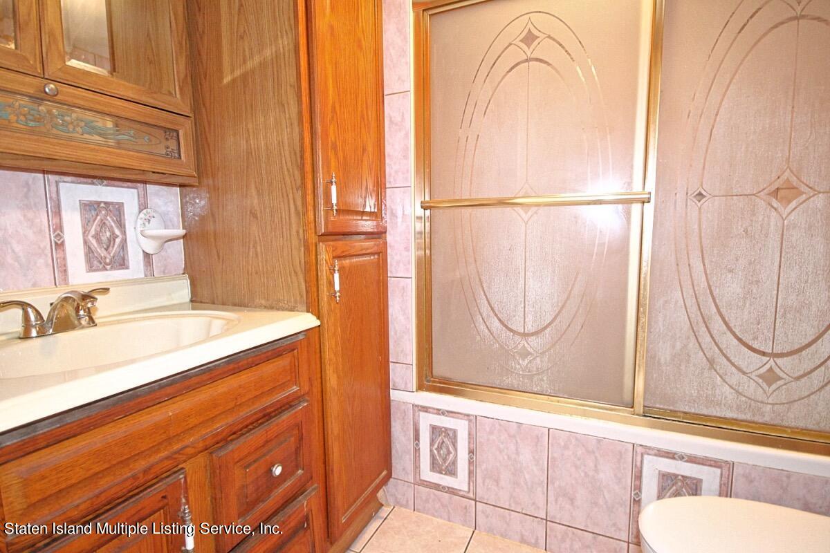 985 Lorimer Street Brooklyn, NY 11222 - Photo 7 of 23 a bathroom with a sink and a mirror