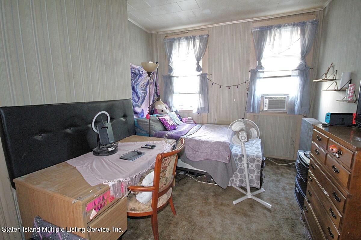 985 Lorimer Street Brooklyn, NY 11222 - Photo 10 of 23 a living room with furniture a window and a fireplace
