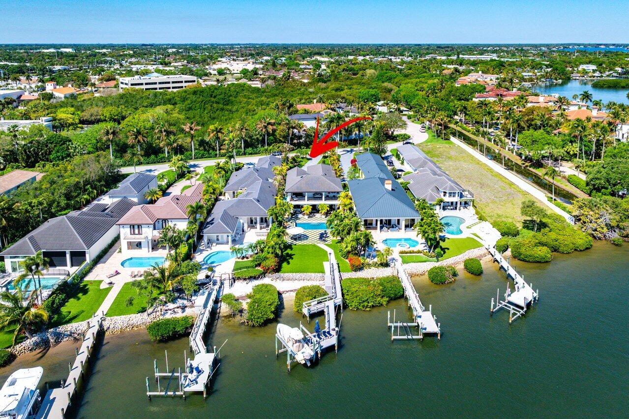an aerial view of a house with a swimming pool yard and outdoor seating