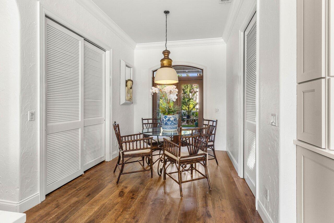 281 Fishermans Way Jupiter, FL 33477 - Photo 12 of 45 a dining room with furniture window wooden floor