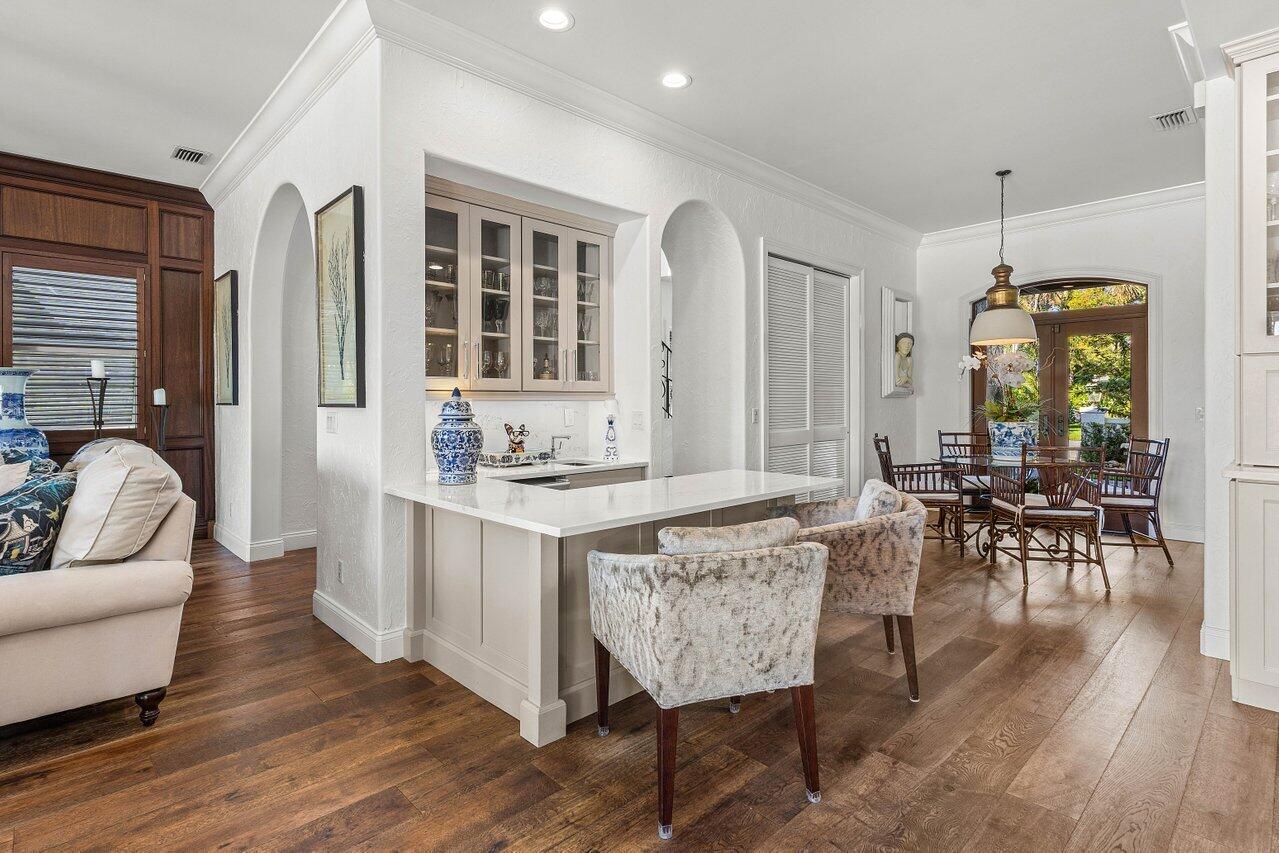 281 Fishermans Way Jupiter, FL 33477 - Photo 17 of 45 a living room with furniture a dining table and a large window