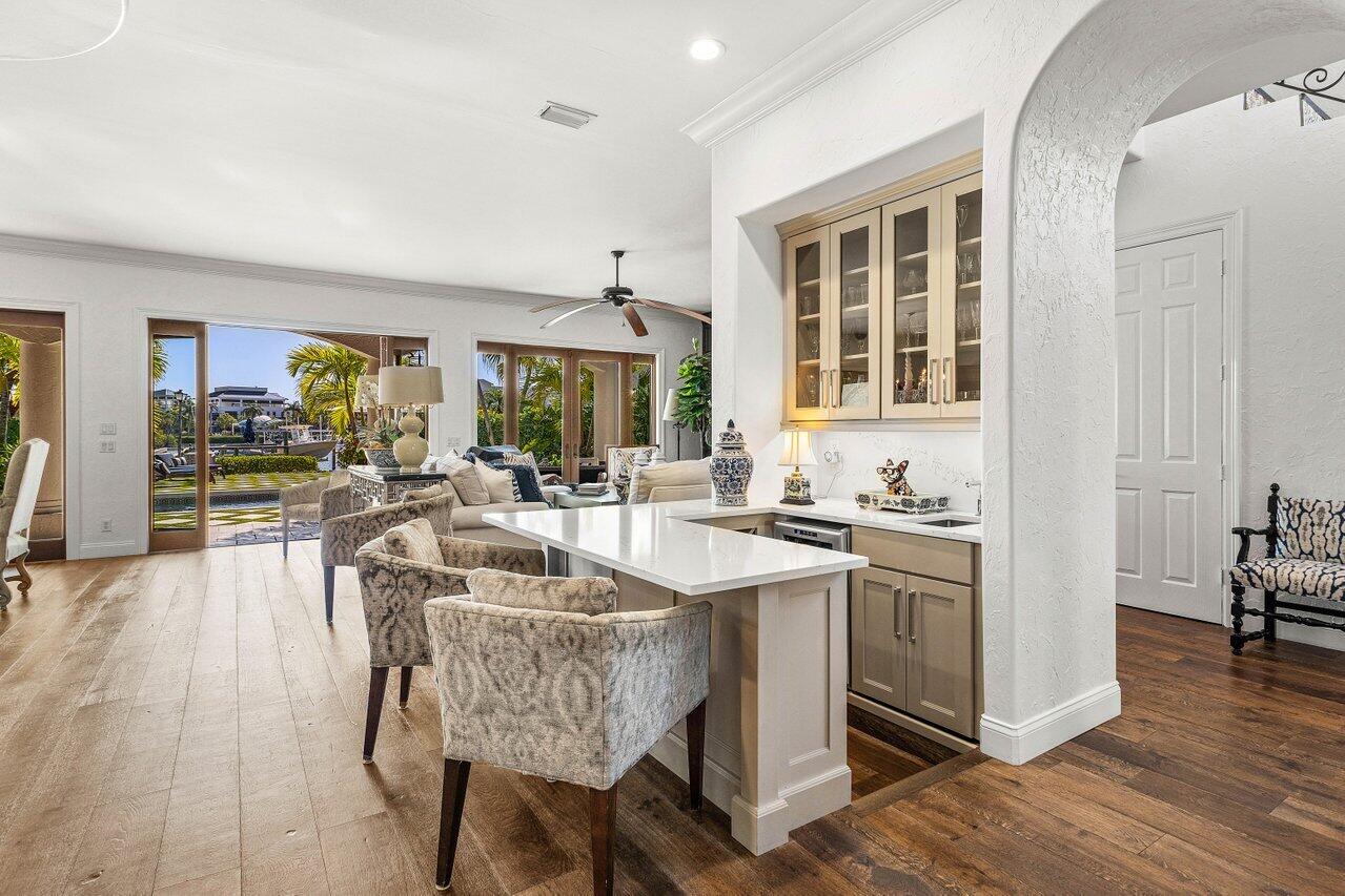281 Fishermans Way Jupiter, FL 33477 - Photo 18 of 45 a view of a dining room with furniture and wooden floor
