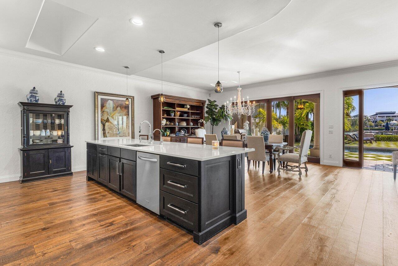 281 Fishermans Way Jupiter, FL 33477 - Photo 21 of 45 a kitchen with stainless steel appliances granite countertop a stove and a wooden floors
